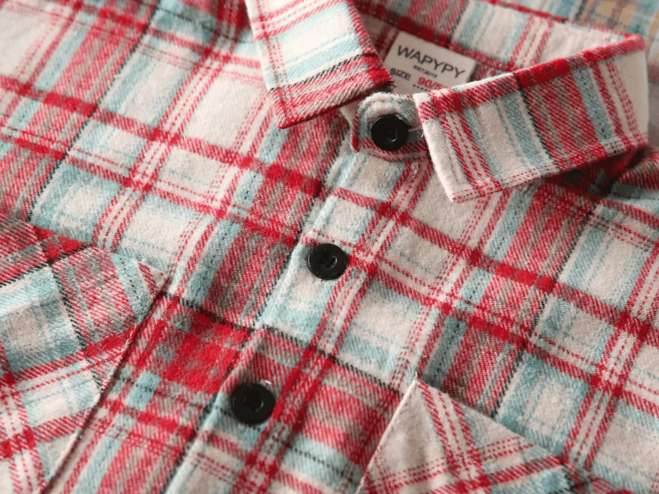 Close-up of a Plaid Long-Sleeved Button-Down Shirt for Kids - SF3523, featuring red and blue checks on soft flannel fabric.